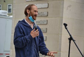 A man identified only as Malcolm speaks at a rally held Saturday at the Grand Parade in downtown Halifax to support a moratorium on the eviction of homeless people from tents and shelters in Halifax Regional Municipality.
