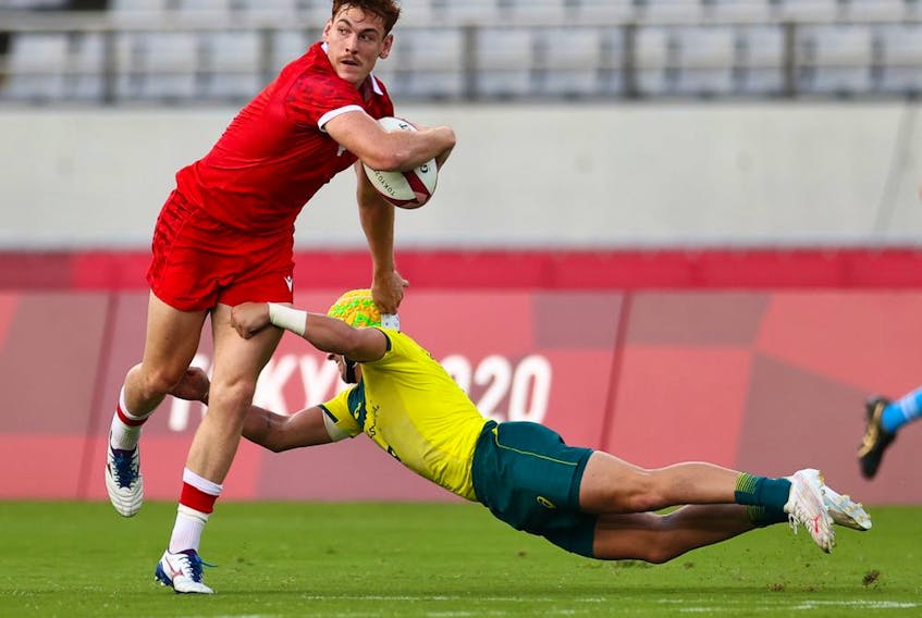 Philip Berna of Canada in action with Josh Coward of Australia at the Tokyo Olympics. 