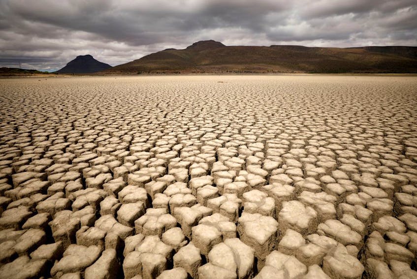  Clouds gather but produce no rain as cracks are seen in the dried up municipal dam in drought-stricken Graaff-Reinet, South Africa.