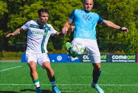HFX Wanderers FC defender Peter Schaale, right, tries to keep the ball away from a York United attacker during Saturday's Canadian Premier League game at York Lions Stadium.
