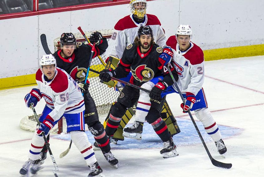 There's a lot of traffic in front of Canadiens netminder Joe Vrbetic during the first period of the game against the Senators. Those in front include Montreal's Mattias Norlander (59) and Kaiden Guhle (21) and Ottawa's Carson Latimer (78) and Mark Kastelic (47).