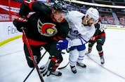  Logan Brown battles along the boards against the Leafs’ Nick Foligno during the Senators game in Ottawa on May 12.