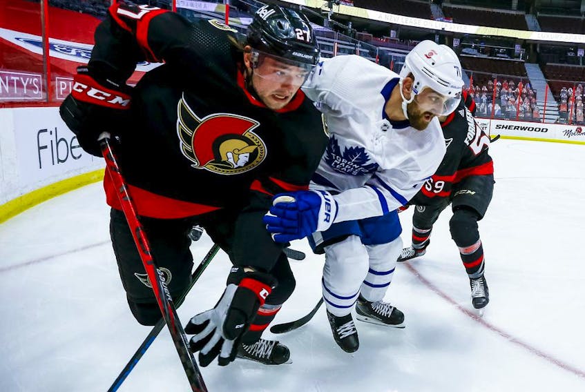  Logan Brown battles along the boards against the Leafs’ Nick Foligno during the Senators game in Ottawa on May 12.