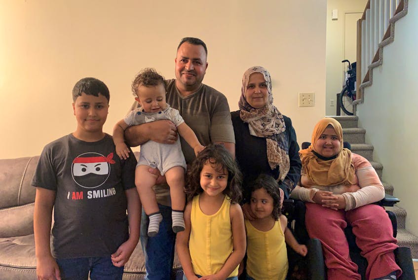 The Al Masri family said communicating with the school was a challenge before receiving help from the YMCA. From left to right (top): Aktham, Elias, Mohammad, Fatema, and Nour. From left to right (bottom): Salsabeel and Rital.