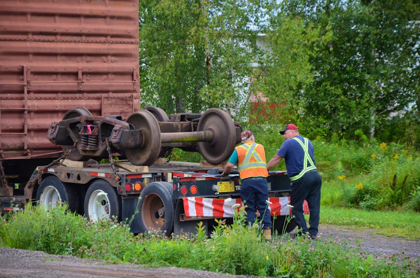 A boxcar and its trucks gifted to the Middleton Railway Museum by the County of Annapolis arrived from the former Upper Clements Park on a flatbed on Aug. 23. CONTRIBUTED