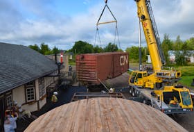 A crew from A.W. Leil Cranes lifts a boxcar gifted by the County of Annapolis onto the tracks at the Middleton Railway Museum. CONTRIBUTED