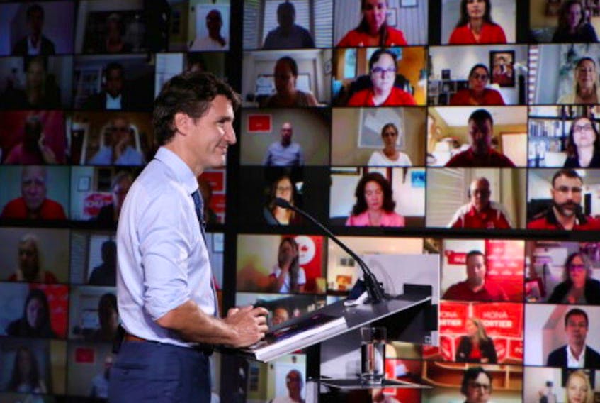 Canada's Liberal Prime Minister Justin Trudeau looks on as he delivers a speech at the Metro Toronto Convention Centre during his election campaign tour in Toronto, Ontario, Canada, September 1, 2021.