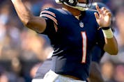  Quarterback Justin Fields #1 of the Chicago Bears passes the ball during the fourth quarter against the Cincinnati Bengals in the game at Soldier Field on September 19, 2021 in Chicago, Illinois. (Photo by Quinn Harris/Getty Images)