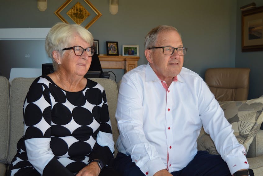 Cardigan MP Lawrence MacAulay, right, and his wife, Frances, watch the national news in their living room in St. Peters Bay on Sept. 20 ahead of the federal election results that night.