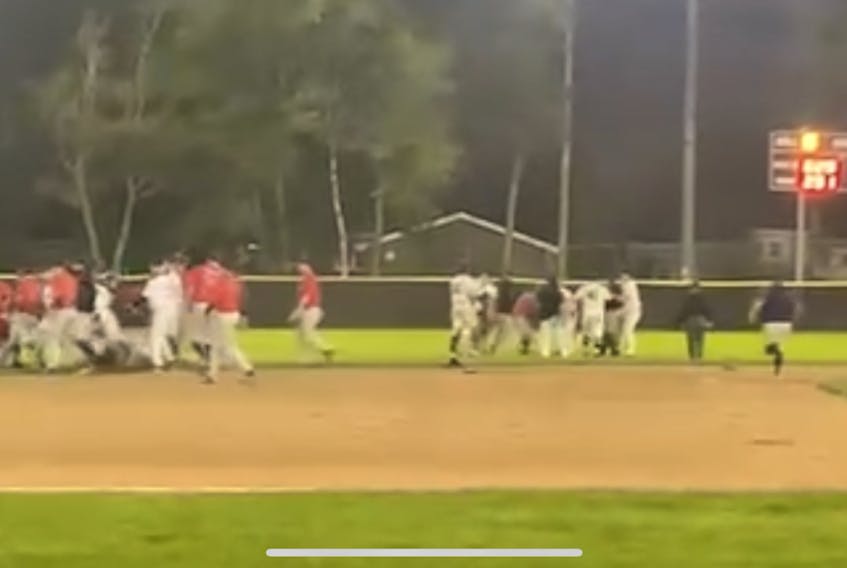 Members of the Sydney Sooners and Dartmouth Mooseheads are shown during a bench-clearing brawl near second base in Game 1 of the Nova Scotia Senior Baseball League championship series at Beazley Field in Dartmouth on Saturday. In total, four players were suspended in the incident.