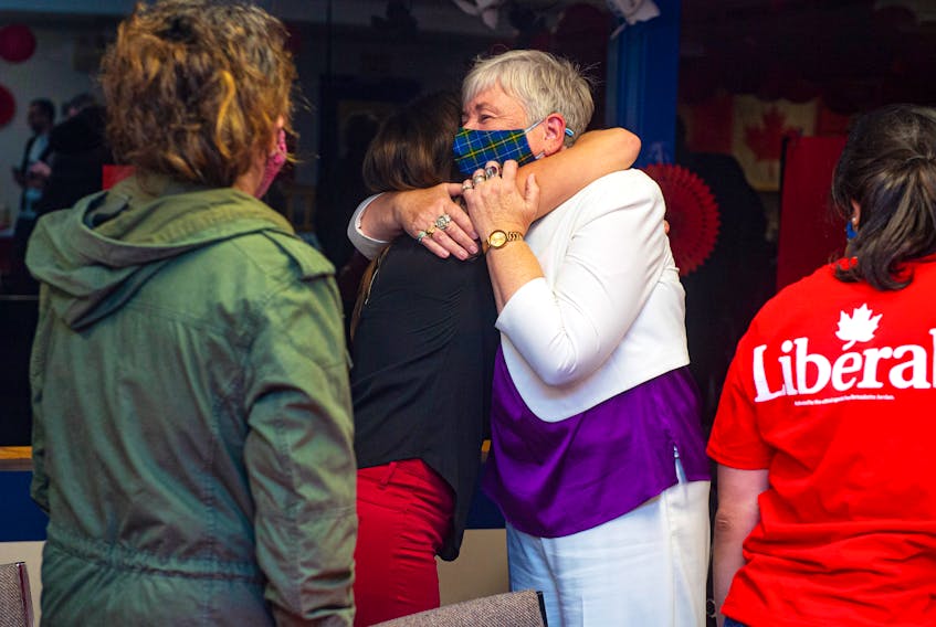 Former fisheries minister Bernadette Jordan hugs supporters at the Bridgewater Curling Club after losing to PC candidate Rick Perkins in the federal election on Monday, Sept. 20, 2021.