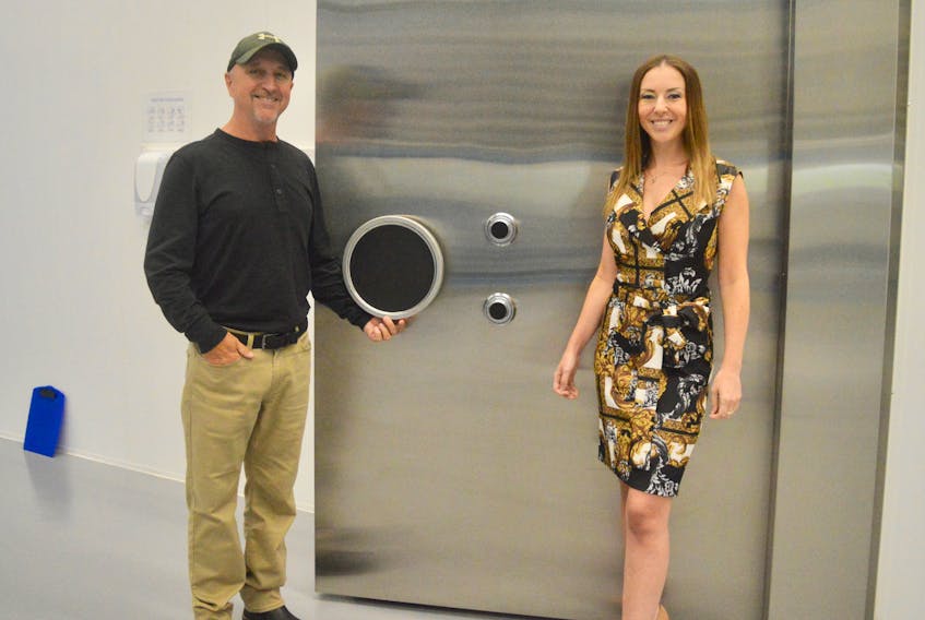 Doug Walsh and daughter Tiffany stand outside the heavy door to the high-security vault where Bluenose Labs Ltd. stores its cannabis products. The former is the facility manager, while the latter is the founder and president of Bluenose’s parent company, Highlander Cannabis Corp. DAVID JALA/CAPE BRETON POST