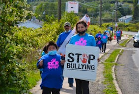Juelz Gould, right, pictured with her son, Malsun, joined dozens of people for an anti-bullying march to support her 10-year-old daughter, Scarlet, who has been the victim of bullying for over a year by a group of older girls in the community. ARDELLE REYNOLDS/CAPE BRETON POST