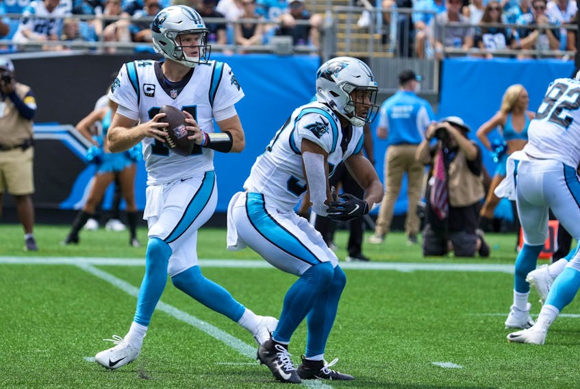 Carolina Panthers quarterback Sam Darnold  back to pass with Canadian running back Chuba Hubbard blocking against the New Orleans Saints.