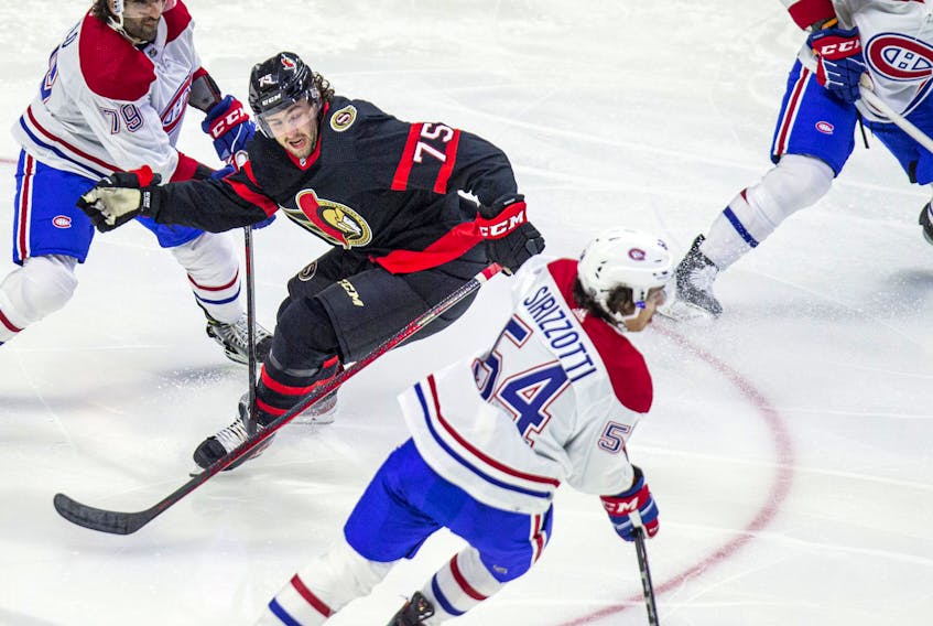 Ottawa Senators' Egor Sokolov battles Canadiens' Tory Dello (left) and Brendan Sirizzotti.