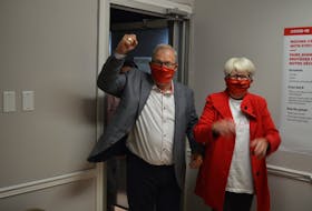 Cardigan MP Lawrence MacAulay, left, and his wife, Frances, arrive at his campaign headquarters in Stratford on Sept. 20 after winning his 11th consecutive term.