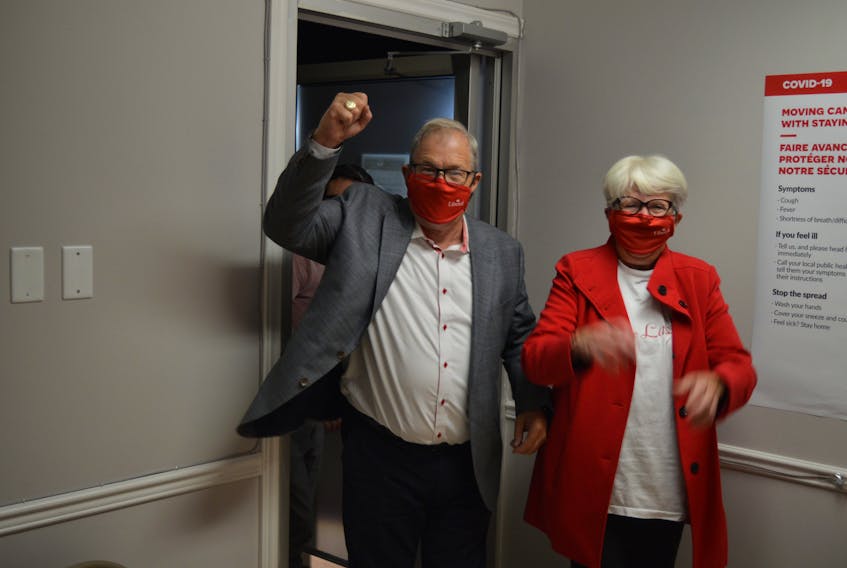 Cardigan MP Lawrence MacAulay, left, and his wife, Frances, arrive at his campaign headquarters in Stratford on Sept. 20 after winning his 11th consecutive term.