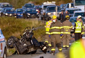 What's left of an ATV sits on the side of the Trans-Canada Highway west of Paddy's Pond Tuesday morning, Sept. 21, 2021. The vehicle was involved in a collision with a sedan. - Keith Gosse