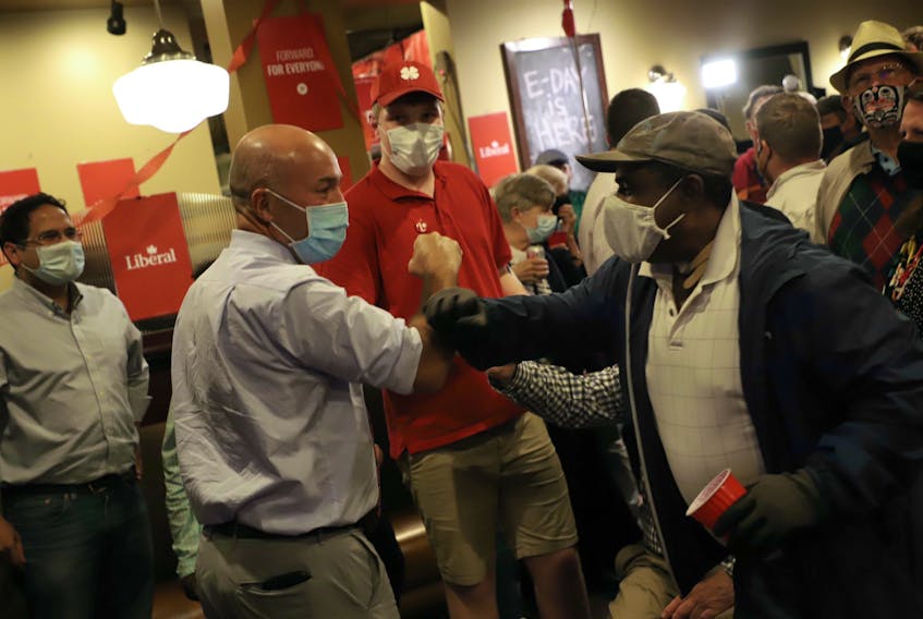 Andy Filmore is welcomed by supporters at his headquarters on Quinpool Road in Halifax just after midnight on Tuesday, Sept. 21, 2021. The Liberal incumbent said the race is still too close to call, as 1,245 votes separate him and NDP candidate Lisa Roberts, with 15 polls left to be counted.