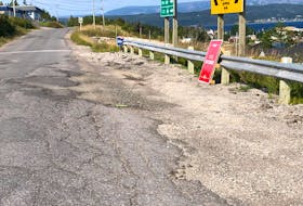 This section of road in Woody Point at the intersection to the road with Trout River needs some repairs.