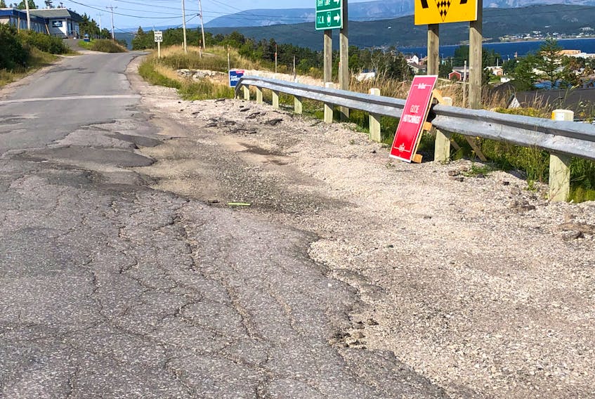 This section of road in Woody Point at the intersection to the road with Trout River needs some repairs.