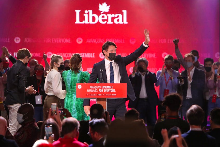 Justin Trudeau, Canada's prime minister, waves to supporters during a Liberal Party election night event in Montreal, Quebec, Canada, in the early hours of Tuesday, Sept. 21, 2021. 
