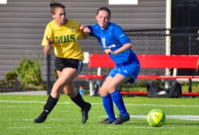 Angelina Cameron of the Sydney Academy Wildcats, right, battles for body position with Sara Barnes of the Memorial Marauders during Cape Breton High School Soccer League girls' junior varsity action at Open Hearth Park in Sydney, Tuesday. Memorial won the game 3-1. JEREMY FRASER/CAPE BRETON POST.
