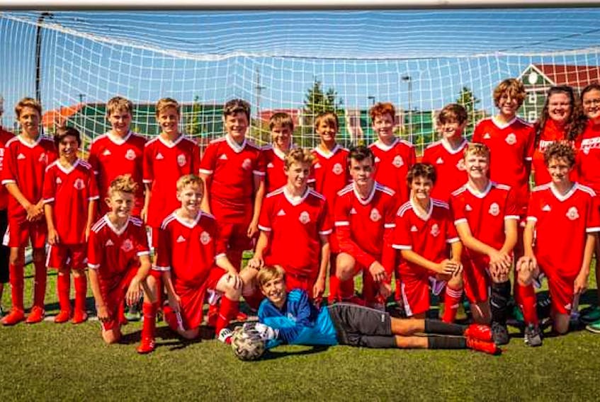 
The Riverview Red under-13 boys' soccer team captured the Cape Breton Cup championship at Cape Breton Health Recreation Complex Turf in Sydney last month. The club defeated the New Waterford Wolves 4-2 in the championship game. Front row, from left, Jason Small, Luke MacDonald, Alex Arsenault, Kyle Moore, Nick Lawrence, Elliot Todd, Cael Rooney, and Anthony Depodesta. Back row, from left, Alison Rowter (assistant coach), Jacob Rowter-MacNeil, Jack Tobin, Camden MacNeil, Micah Barrett, Lachlan Stewart, Luke MacDougall, Evan MacNeil, Chase Doyle, Troy Small, Caleb Jones, Mary MacDonnell-Moore (head coach), and Samantha Lawrence (assistant coach). PHOTO CONTRIBUTED/MARY ROSE MACDONALD.