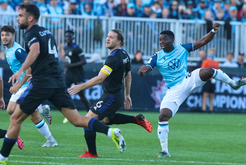 HFX Wanderers’ Corey Bent, right,  watches his shot go into the  CF Montreal net as a couple of defenders look on helplessly during the Canadian Championship soccer quarter-final game at the Wanderers Grounds on Wednesday night. Eric Wynne