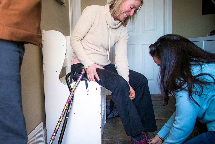  Jessica Service and Karin Hohban have developed a close friendship after the Westboro bus crash. Service helped to save Hohban’s leg the day of the crash and was helping her with her shoe on Sunday Jan. 5, 2020.
