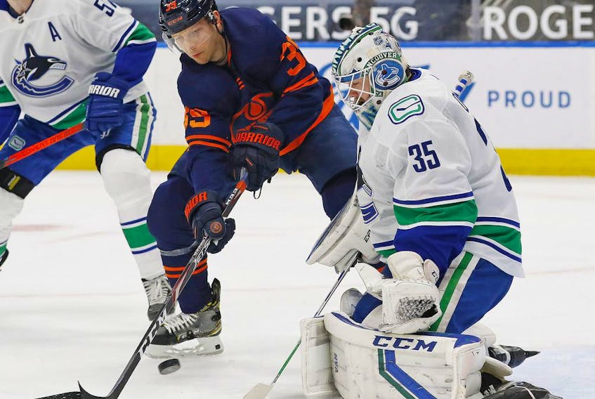 Winger Alex Chiasson, jamming the net against Canucks goalie Thatcher Demko last season, has joined the Canucks on a professional tryout basis. He scored nine goals in 45 games last year for the Edmonton Oilers.