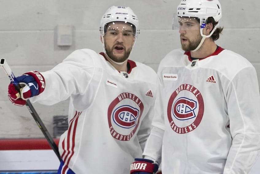 Jonathan Drouin (left) and Josh Anderson chat Thursday morning as the Canadiens hit the ice for the first time during training camp at the Bell Sports Complex in Brossard.