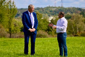 Minister of Municipal Affairs and Housing John Lohr speaks with West Hants Mayor Abraham Zebian following a provincial funding announcement Sept. 24 that will see equalization payments doubled this year.