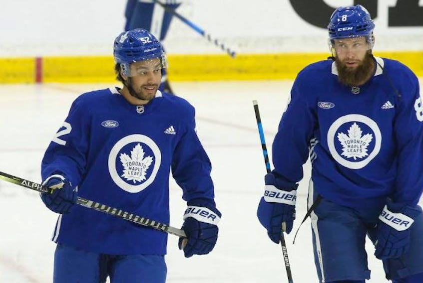 Toronto Maple Leafs Jake Muzzin (right) with newcomer Josh Ho-Sang on the first day of on ice activity at training camp in Toronto on Thursday. Jack Boland/Toronto Sun