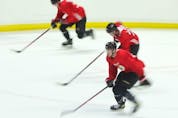  The Ottawa Senators take part in skating drills on Thursday.