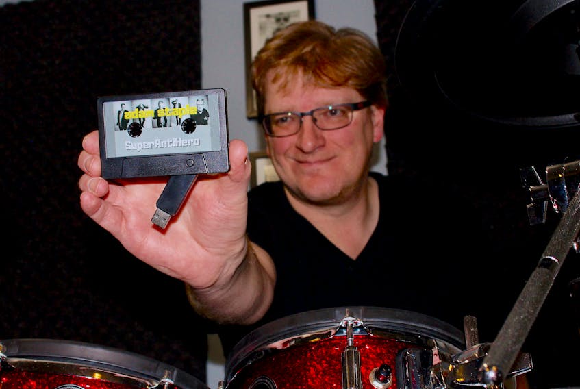 While Adam Staple's album "SuperAntiHero" is available on all major streaming platforms, he also had these USB cassettes made for purchase. A musician in St. John's for 30 years, this is his first solo recording project of original material.