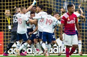  Vancouver Whitecaps players celebrate after goalkeeper Maxime Crepeau (16) stopped FC Dallas’ Franco Jara on a penalty kick during the second half of an MLS soccer game in Vancouver, on Saturday, September 25, 2021.
