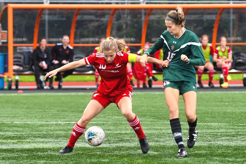 Memorial's Katie Joyce fends off Cape Breton's Caleigh Macpherson during AUS women's soccer action in Sydney, N.S., on Saturday. Joyce and the Sea-Hawks were held off the scoresheet in a 1-0 loss to the Capers, but bounced back for a 2-0 win over previously undefeated St.FX on Sunday, with Joyce scoring one of Memorial's goals. — CBU Athletics