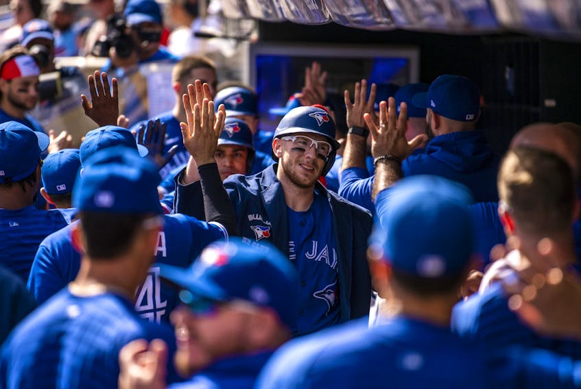  Blue Jays’ Danny Jansen celebrates with teammates while wearing the blue Home Run Jacket after hitting a three-run home run in the second inning against the Minnesota Twins at Target Field on Sept. 26, 2021 in Minneapolis. Stephen Maturen/Getty Images