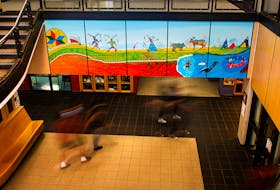 Bay View High students walk underneath a mural at the school in this long-exposure photo taken on Tuesday, Sept. 28, 2021. The mural was created by renowned Mi'kmaq artist Alan Syliboy.
Ryan Taplin - The Chronicle Herald