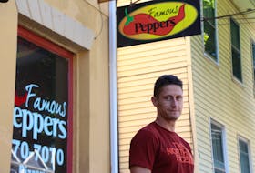 Famous Peppers co-owner David Mitchell stands in front of his pizza parlour on Kent Street. The company has relocated after 10 years at this location to a new spot in the shops of St. Avards plaza on St. Peters Road .