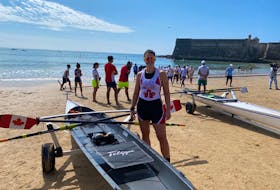 Brienne Miller of Halifax, centre, captured the gold medal at the World Rowing Coastal Beach Sprint Championships in Portugal on Sunday.  - Contributed