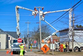 Crews from Nova Scotia Power work on an upgrade at the corner of Academy and Spring streets in Amherst in 2018. File