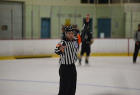 Referee Tanner Doiron keeps an eye on the line changes at a stoppage in play during a Quebec Major Junior Hockey League (QMJHL) pre-season game in Cornwall recently. Doiron, from Summerside, is entering his first season as a QMJHL referee after working the last three years as a linesman.