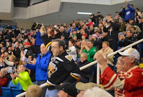 It’s been a longtime since fans of the Cape Breton Eagles have been able to take in a game at Centre 200 under somewhat normal conditions. Above, longtime supporter Dennis MacIntyre, wearing an Eagles jersey and ringing a cowbell, leads the crowd in cheering a few years ago at the Sydney facility. The Eagles play their 2021-22 QMJHL season-opening match on Friday when they host the Halifax Mooseheads. DAVID JALA • CAPE BRETON POST