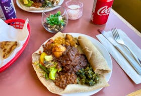 The medium injera veggie combo plus doro wot is pictured is quite plentiful, but also comes in large. GABBY PEYTON PHOTO 