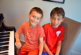 Nine-year-old Benjamin and 11-year-old Nathan Woo of Kentville are both Atlantic Canadian gold medal winners for piano from the Royal Conservatory of Music. KIRK STARRATT