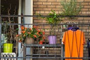 An orange t-shirt hangs on a balcony in Toronto in preparation for the first National Day for Truth and Reconciliation on Thursday, Sept. 30. (Peter J Thompson/National Post)