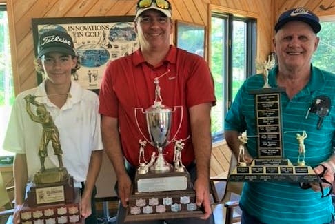 Holding the silverware at the Brookfield Golf & Country Club are Nick Penny (left), the 2021 junior champion, Mike Penny the 2021 men’s champion, and Victor Penny who won the 2002 senior men’s championship.