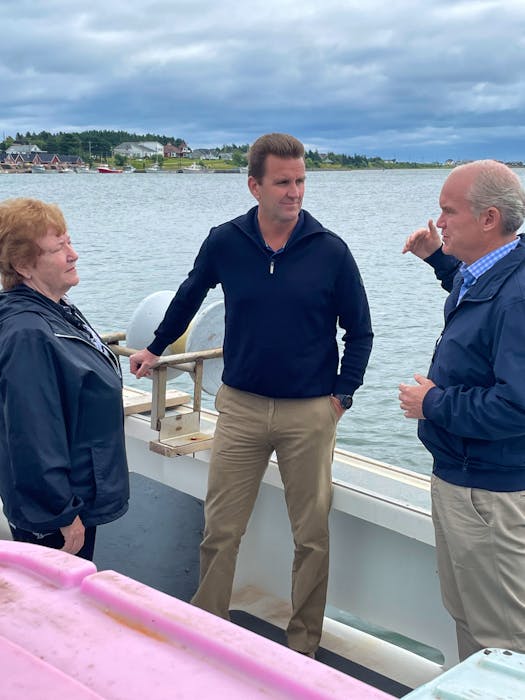 Conservative candidate for Malpeque Jody Sanderson, middle, with North Rustico Mayor Anne Kirk and Conservative leader Erin O'Toole talk on a boat in North Rustico Harbour during O'Toole's stop in P.E.I. on the weekend of Sept. 28. - Colin Maclean